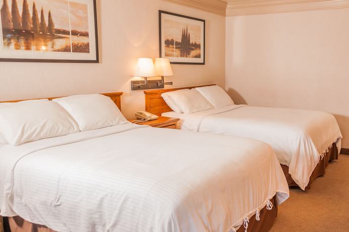 Imagen de la habitación del Hotel Coachman Inn And Suites. Foto 15