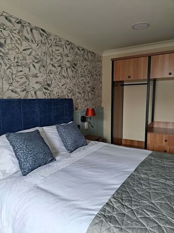 Imagen de la habitación del Hotel Coachmans Inn. Foto 19