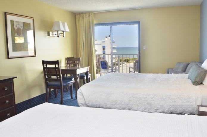 Imagen de la habitación del Hotel Coastal Palms Inn and Suites. Foto 15