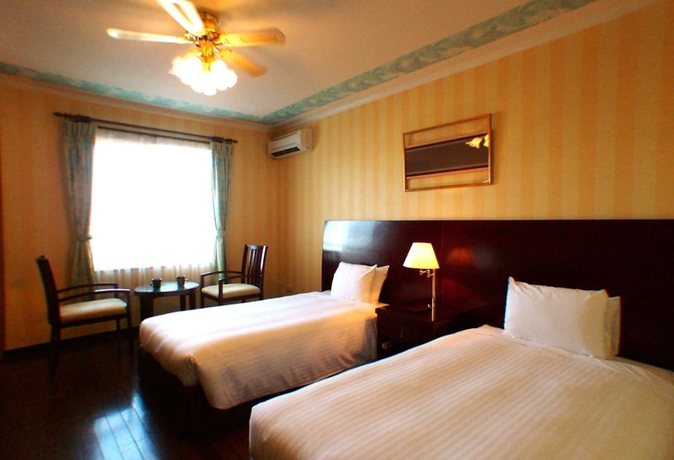 Imagen de la habitación del Hotel Coco Garden Resort Okinawa. Foto 7