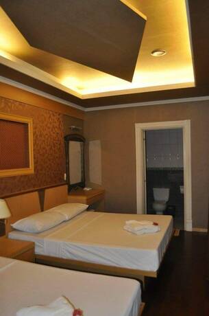 Imagen de la habitación del Hotel Coco Paradise Beach Resort. Foto 18