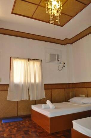 Imagen de la habitación del Hotel Coco Paradise Beach Resort. Foto 19