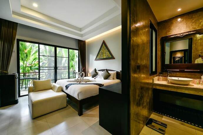 Imagen de la habitación del Hotel Coco Paradiso Phuket. Foto 18