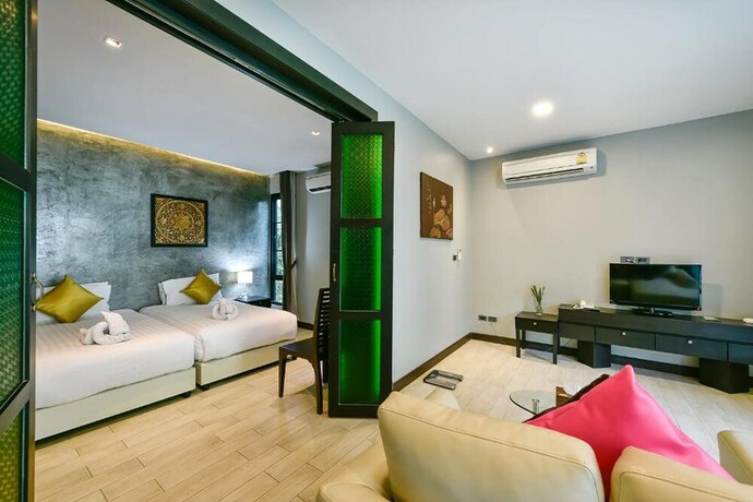 Imagen de la habitación del Hotel Coco Paradiso Phuket. Foto 36