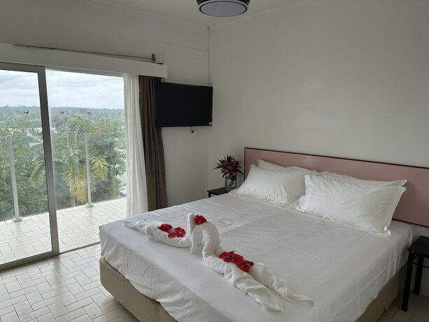 Imagen de la habitación del Hotel Coconut Palms Resort and Diamond Casino. Foto 19
