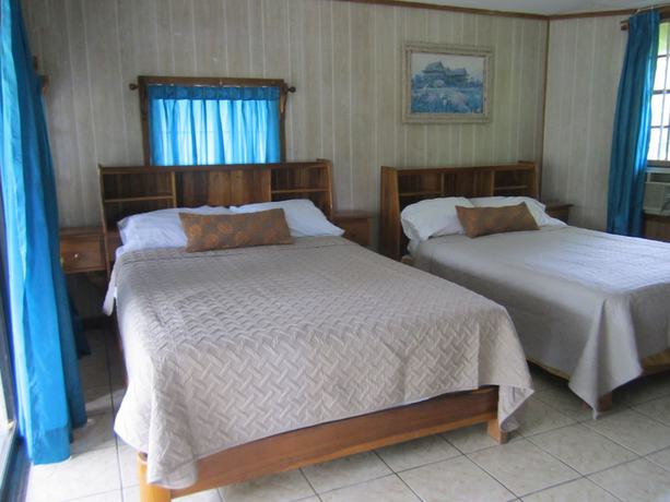 Imagen de la habitación del Hotel Coconut Tree West Bay. Foto 7