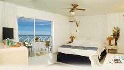 Imagen de la habitación del Hotel Cocoplum Beach. Foto 3