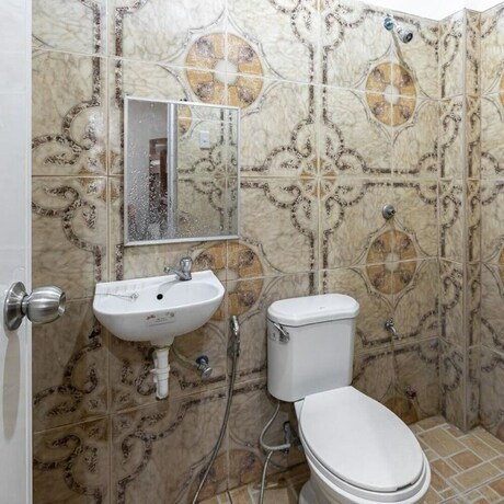 Imagen de la habitación del Hotel Coffee Swings Lodging House. Foto 16