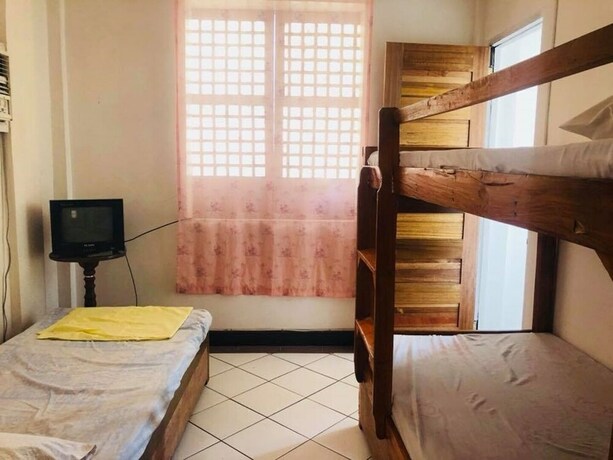 Imagen de la habitación del Hotel Coffee Swings Lodging House. Foto 17