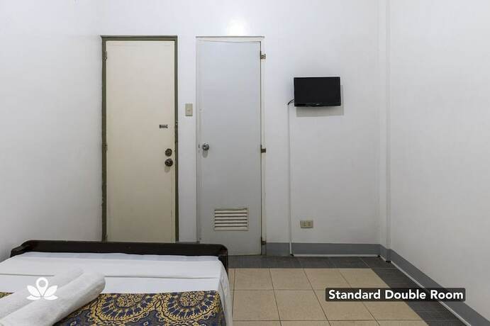 Imagen de la habitación del Hotel Coffee Swings Lodging House. Foto 18