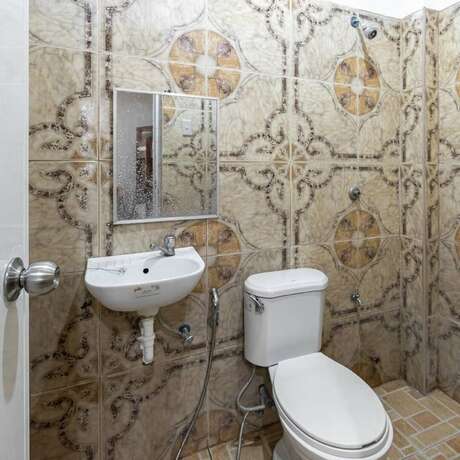 Imagen de la habitación del Hotel Coffee Swings Lodging House. Foto 23