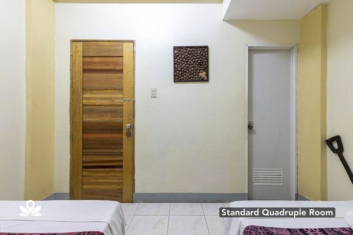 Imagen de la habitación del Hotel Coffee Swings Lodging House. Foto 27