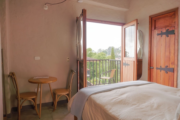 Imagen de la habitación del Hotel Coffee Tree Boutique Hostel. Foto 9