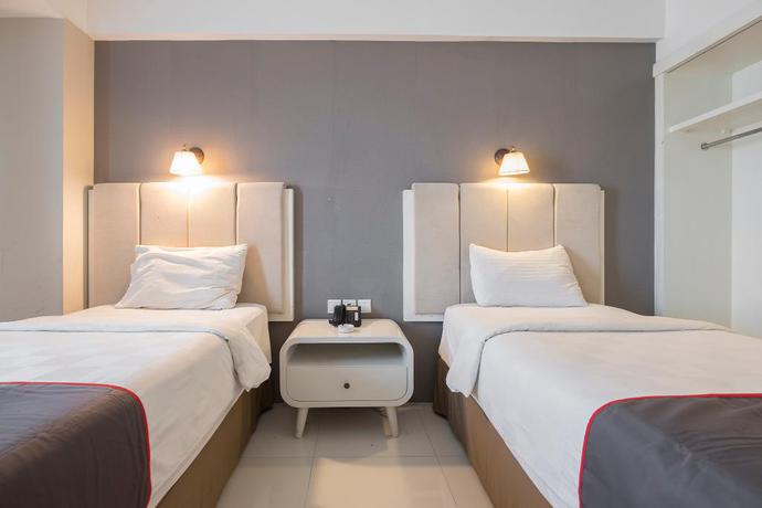 Imagen de la habitación del Hotel Collection O 19 Grand Malebu Makassar. Foto 6