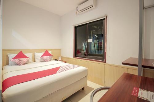 Imagen de la habitación del Hotel Collection O 295 Grha Ciumbuleuit Guest House. Foto 17