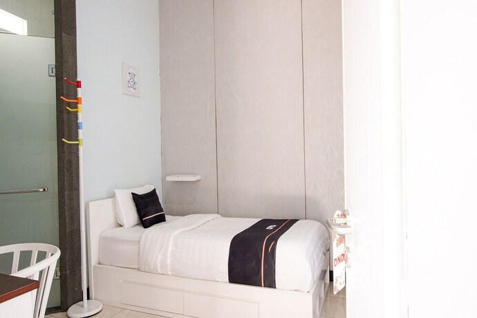 Imagen de la habitación del Hotel Collection O 3986 Just 11 Boutique. Foto 20