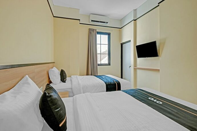 Imagen de la habitación del Hotel Collection O 90774 Homi Stay. Foto 17