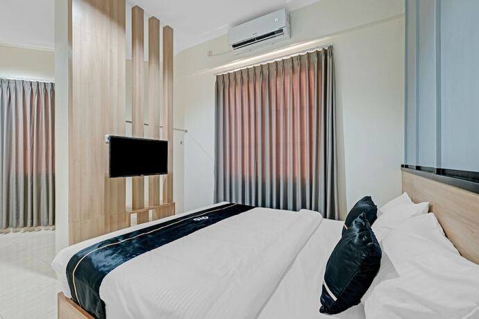 Imagen de la habitación del Hotel Collection O 90774 Homi Stay. Foto 18