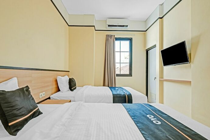 Imagen de la habitación del Hotel Collection O 90774 Homi Stay. Foto 19