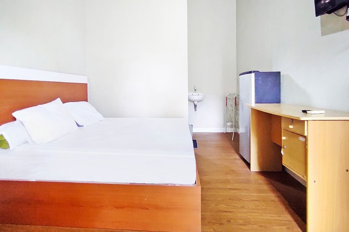 Imagen de la habitación del Hotel Collection O 91046 Remaja Indah Masamba. Foto 7
