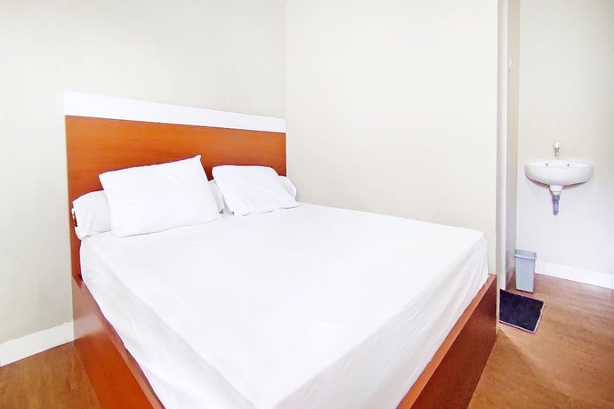 Imagen de la habitación del Hotel Collection O 91046 Remaja Indah Masamba. Foto 9