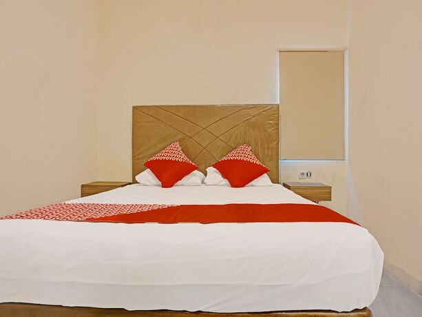 Imagen de la habitación del Hotel Collection O 91414 Marina Beach. Foto 15