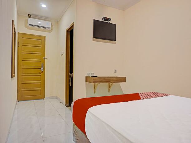 Imagen de la habitación del Hotel Collection O 91414 Marina Beach. Foto 16