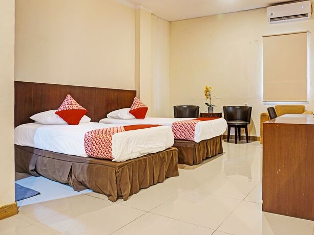 Imagen de la habitación del Hotel Collection O 91414 Marina Beach. Foto 17