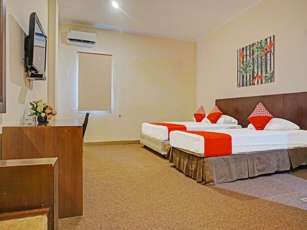 Imagen de la habitación del Hotel Collection O 91414 Marina Beach. Foto 18