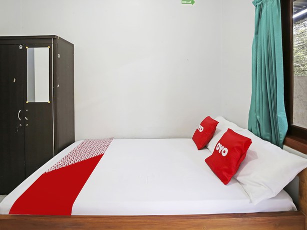 Imagen de la habitación del Hotel Collection O 91449 Griya Ampenan Residence. Foto 3