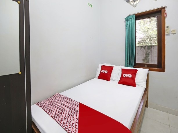 Imagen de la habitación del Hotel Collection O 91449 Griya Ampenan Residence. Foto 11