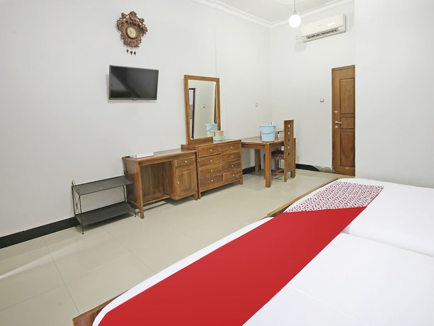 Imagen de la habitación del Hotel Collection O 91449 Griya Ampenan Residence. Foto 15