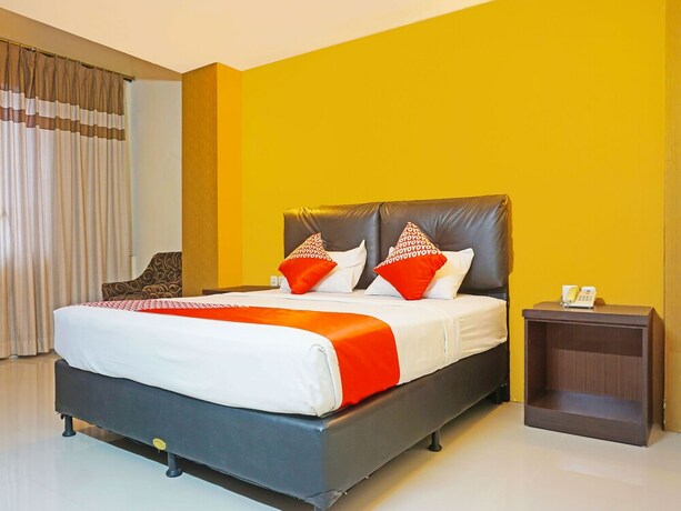 Imagen de la habitación del Hotel Collection O 91565 Grand Populer. Foto 12