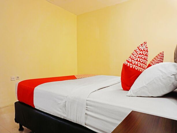 Imagen de la habitación del Hotel Collection O 91565 Grand Populer. Foto 15