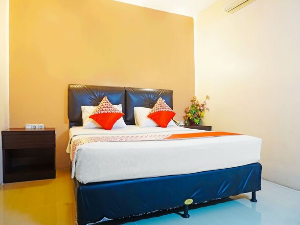Imagen de la habitación del Hotel Collection O 91565 Grand Populer. Foto 16