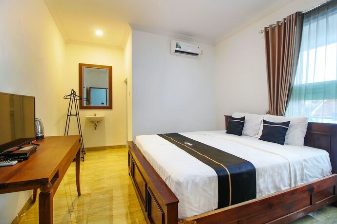 Imagen de la habitación del Hotel Collection O 91605 Nexdeco House Homestay Syariah. Foto 18
