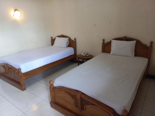 Imagen de la habitación del Hotel Collection O 92242 Tanjung Emas. Foto 19