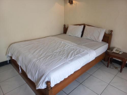 Imagen de la habitación del Hotel Collection O 92242 Tanjung Emas. Foto 20