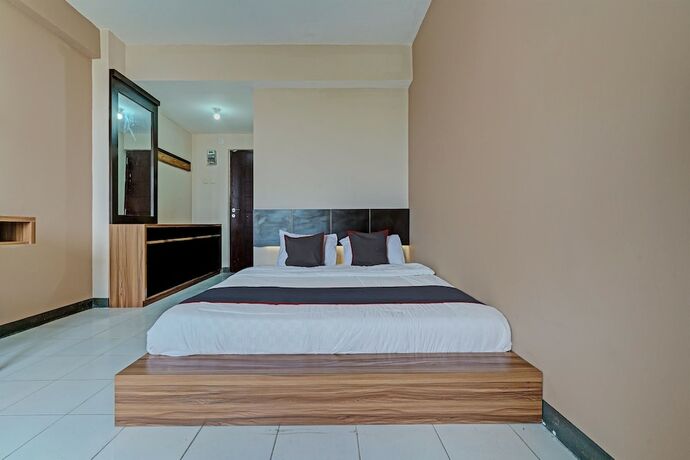 Imagen de la habitación del Hotel Collection O 92643 Emerald Apartement By Tahha Hospitality. Foto 19
