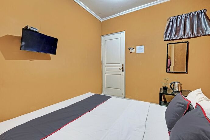 Imagen de la habitación del Hotel Collection O 92864 Mitra Residence. Foto 17