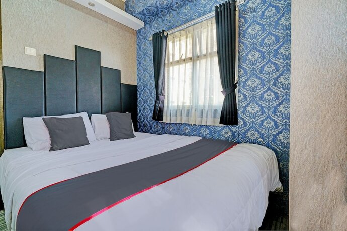 Imagen de la habitación del Hotel Collection O 93070 Apartemen The Suite Metro By Sultan Property Ii. Foto 18