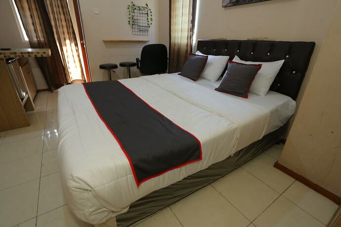 Imagen de la habitación del Hotel Collection O 93142 Lion Rooms. Foto 13