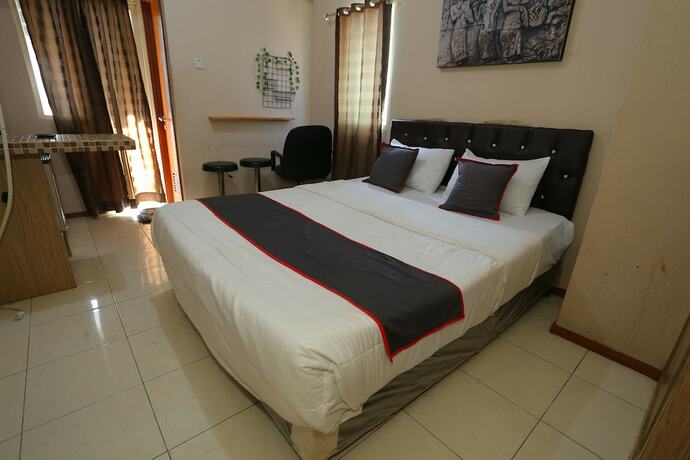 Imagen de la habitación del Hotel Collection O 93142 Lion Rooms. Foto 14