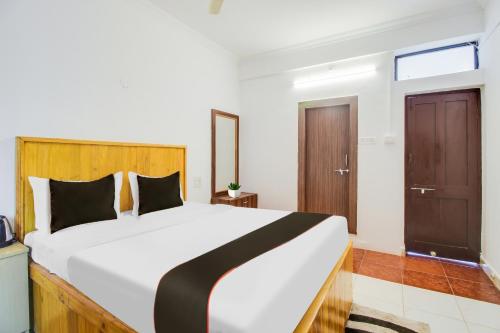 Imagen de la habitación del Hotel Collection O Bay 11. Foto 19