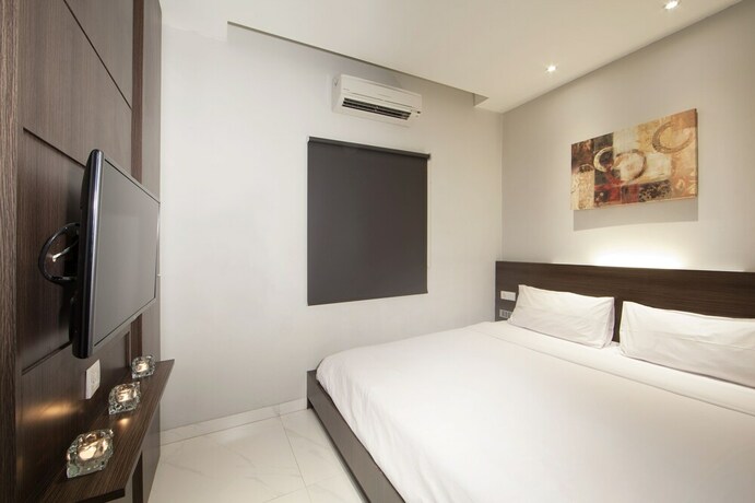 Imagen de la habitación del Hotel Collection O Cihampelas Near Ciwalk Formerly Regia Cihampelas. Foto 6