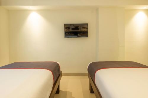 Imagen de la habitación del Hotel Collection O Hotel Pasar Baru Heritage. Foto 12