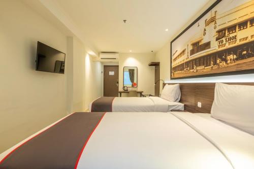Imagen de la habitación del Hotel Collection O Hotel Pasar Baru Heritage. Foto 15