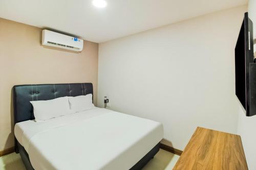 Imagen de la habitación del Hotel Collection O Kebon Jeruk Near Paskal 23 Formerly Sentral Paskal. Foto 15