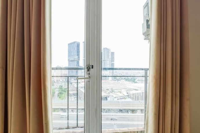 Imagen de los interiores del Hotel Collection O Serviced Apartmen Mutiara Kota. Foto 11