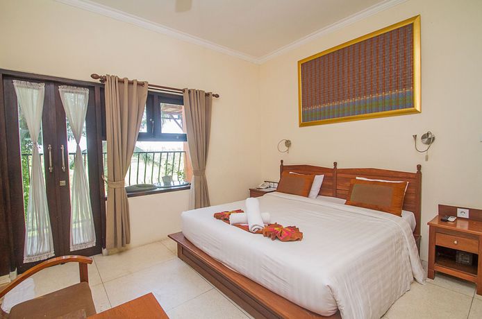 Imagen de la habitación del Hotel Collection O Ubud Near Central Ubud. Foto 10